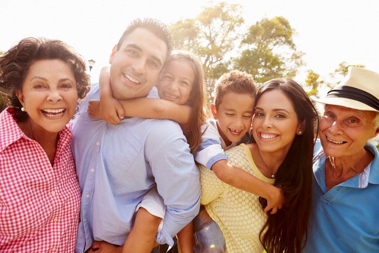 A group of people that are smiling for the camera